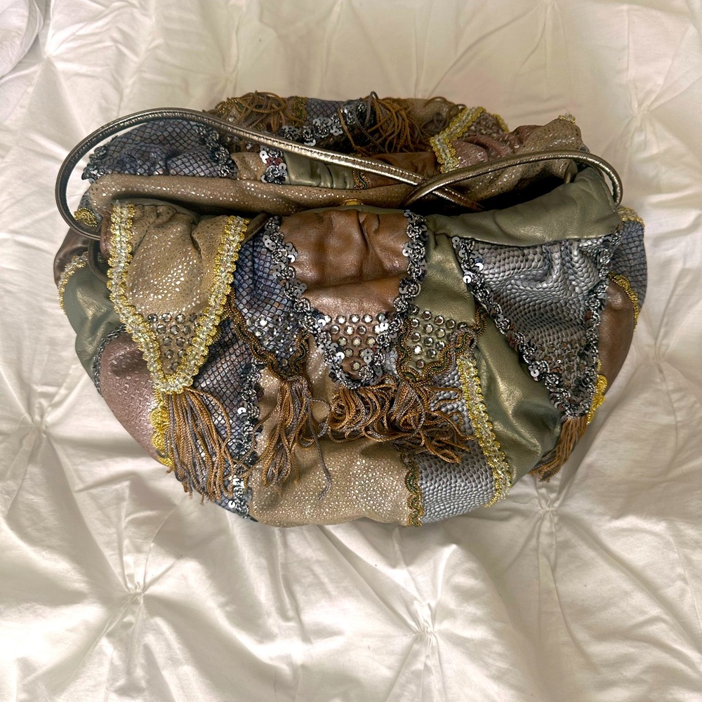 Mylinka metallic colors leather purse with tassels.